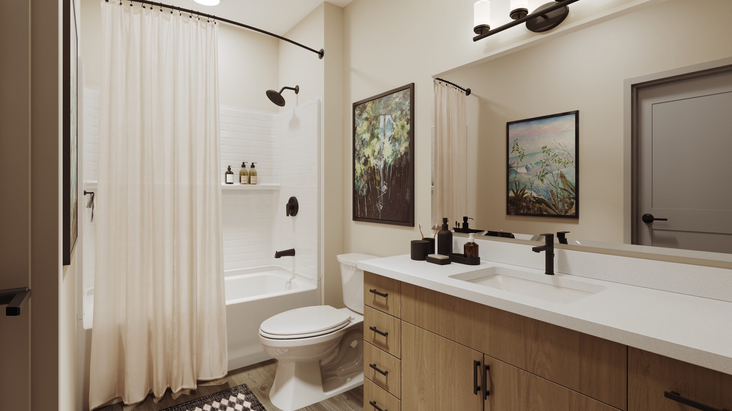 Model bathroom with granite countertops and tiled tub/shower combination at Creekside at the Grounds