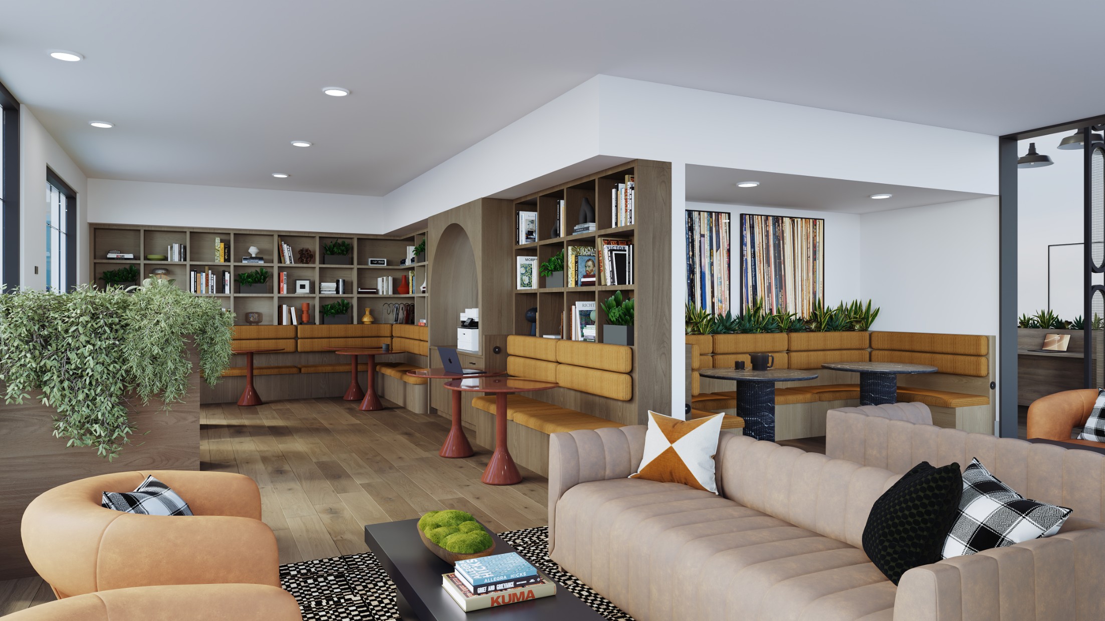 Resident lounge with sofas and bookshelves at Creekside at the Grounds