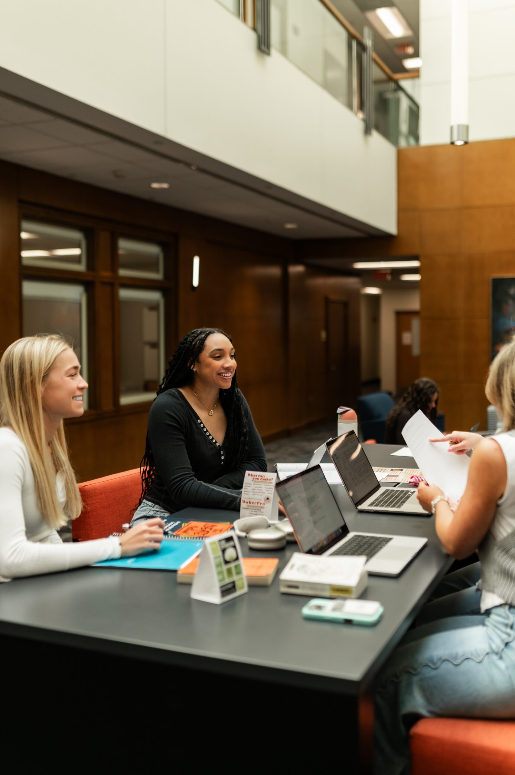 college students studying in campus lounge scaled