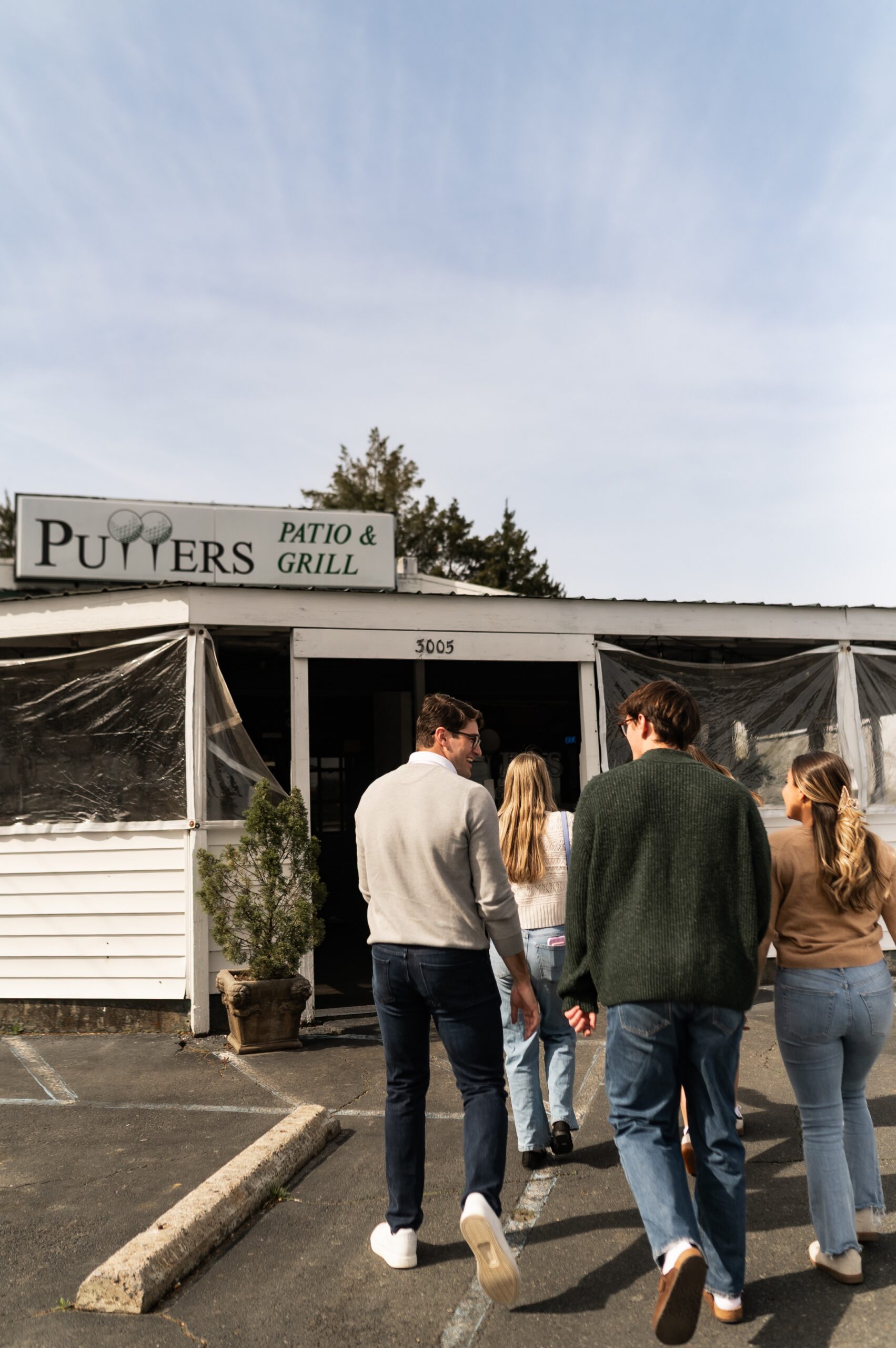 group walking to local patio grill scaled