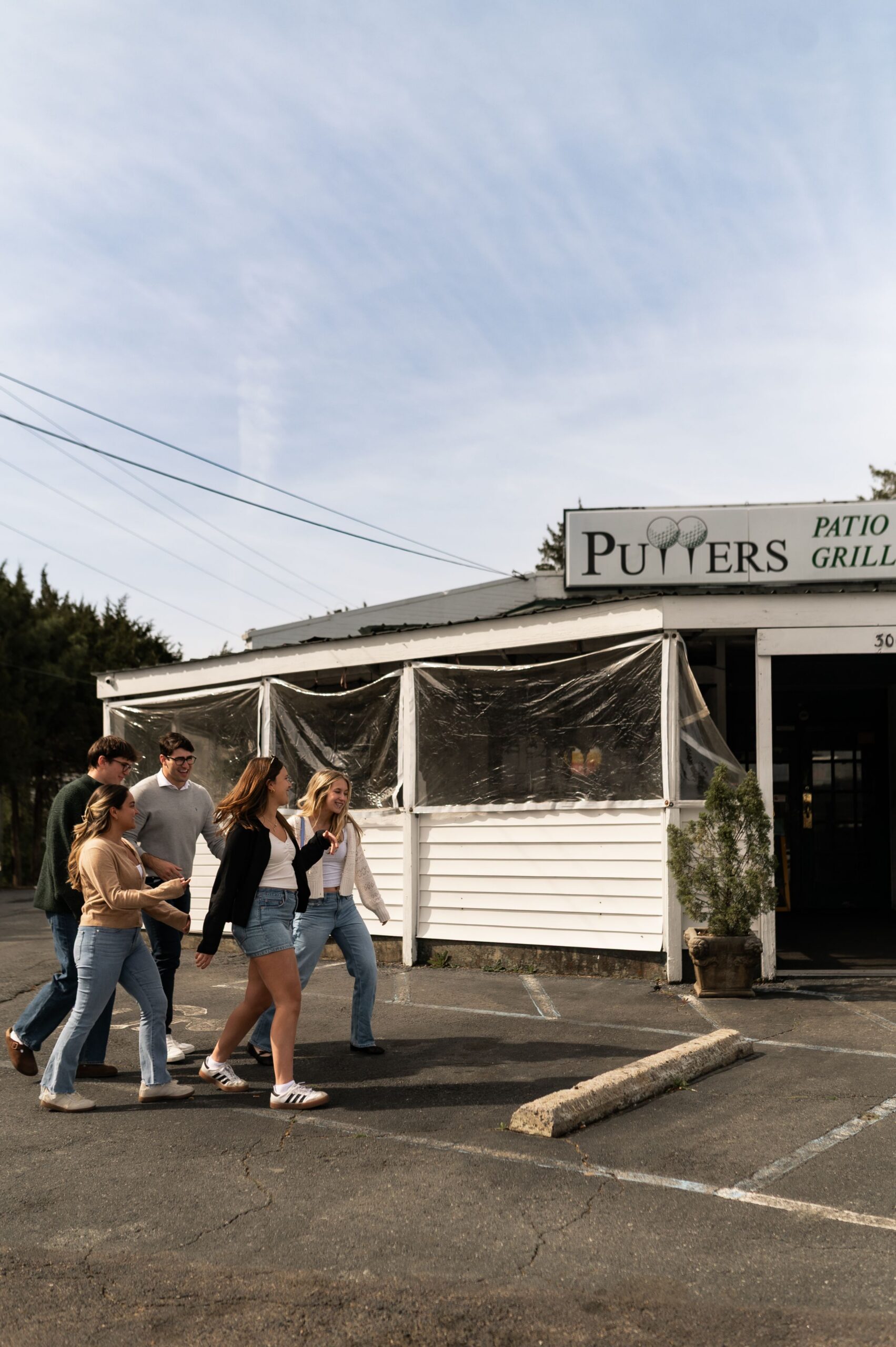 group walking toward local restaurant scaled