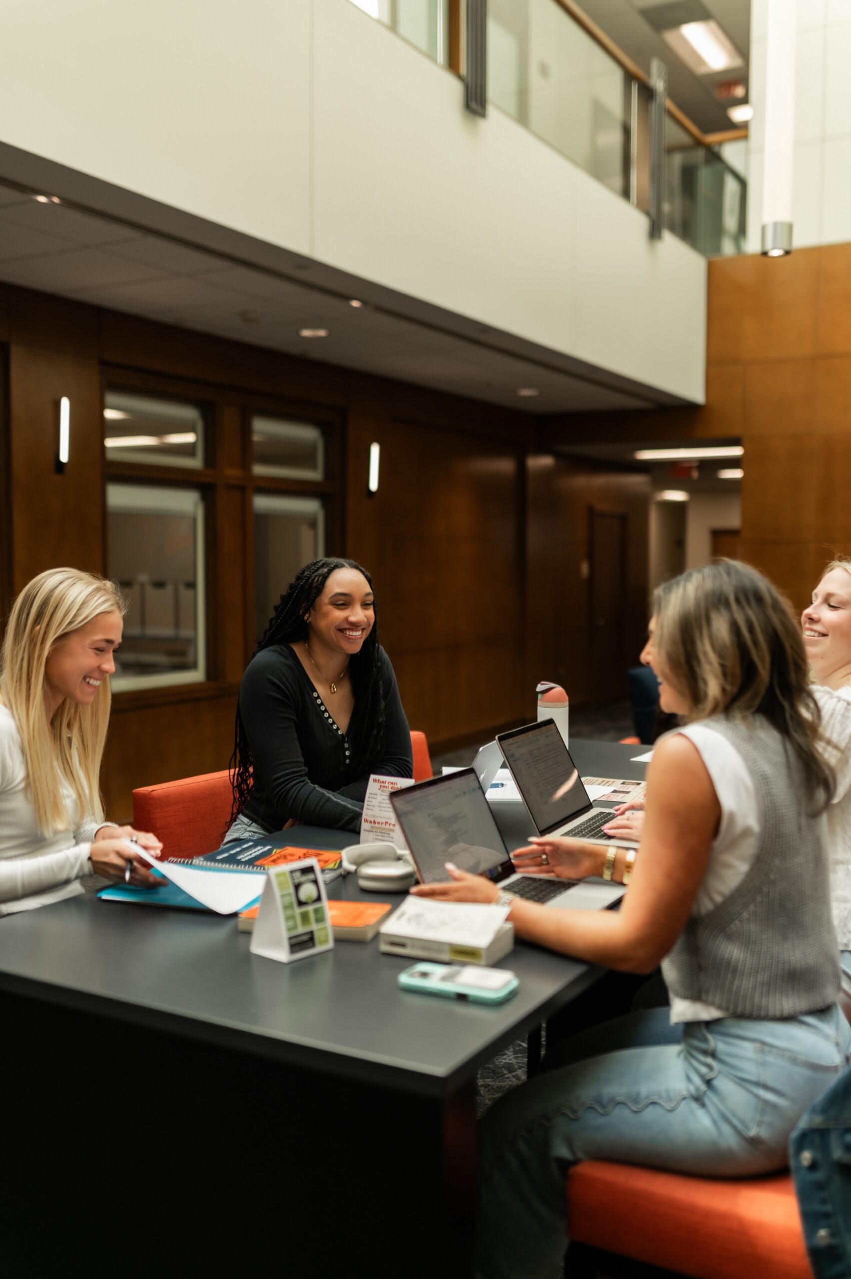 students collaborating at university workspace scaled