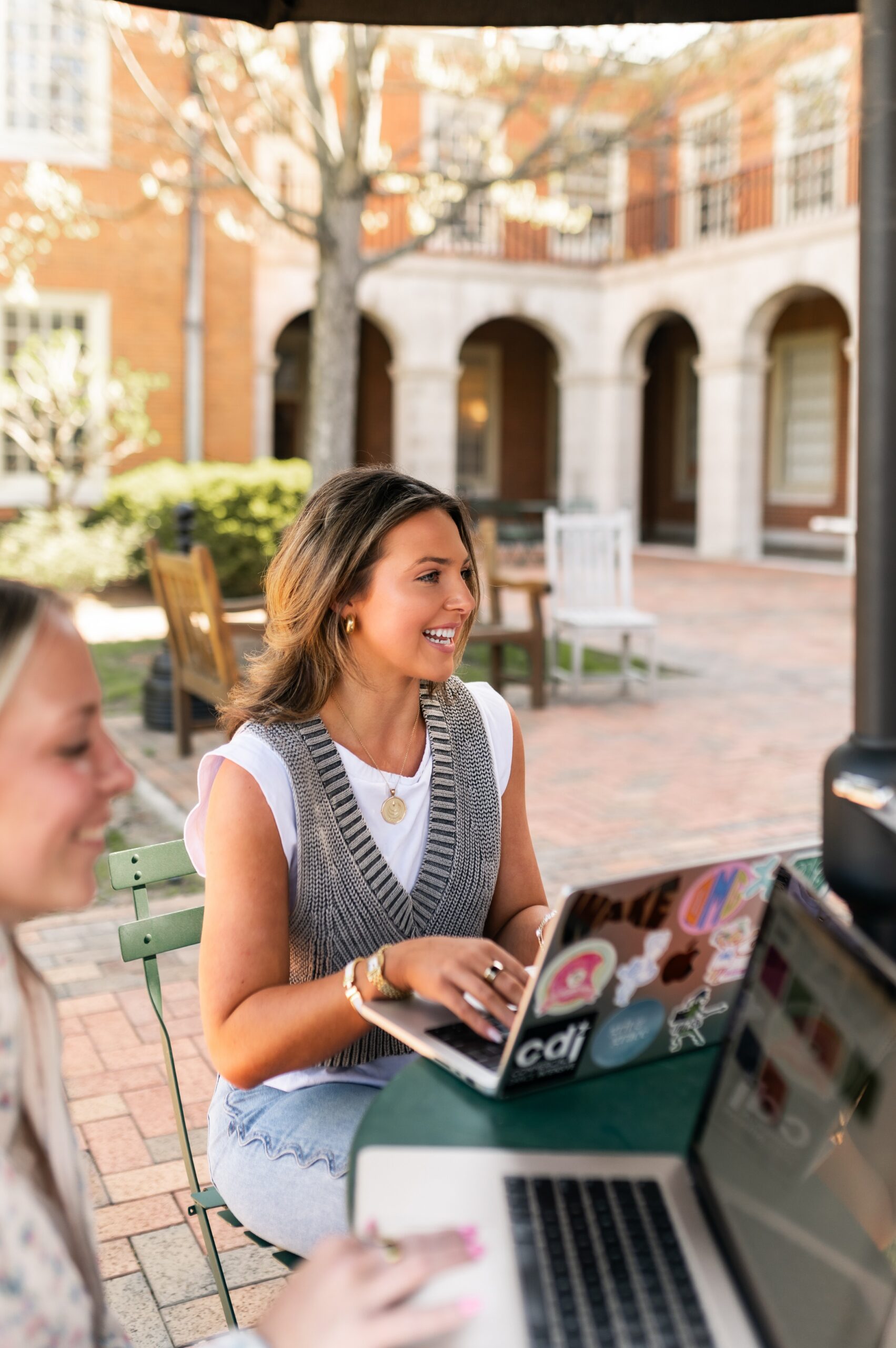 students collaborating in campus courtyard scaled
