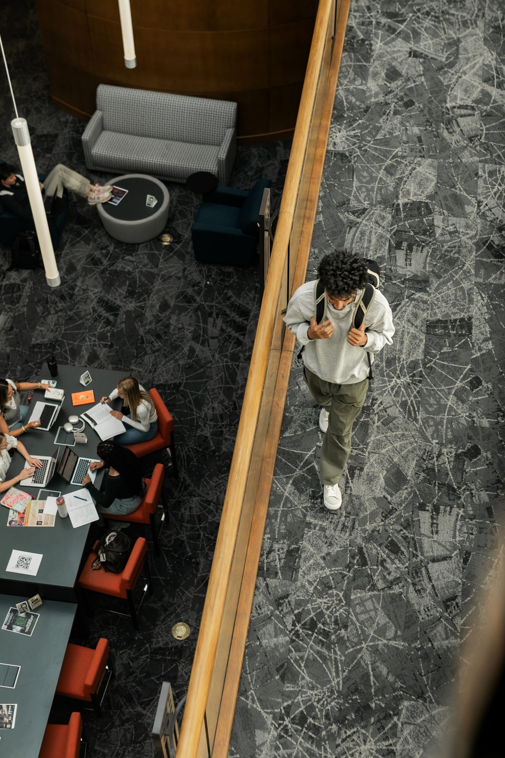undergraduate traversing indoor academic mezzanine scaled