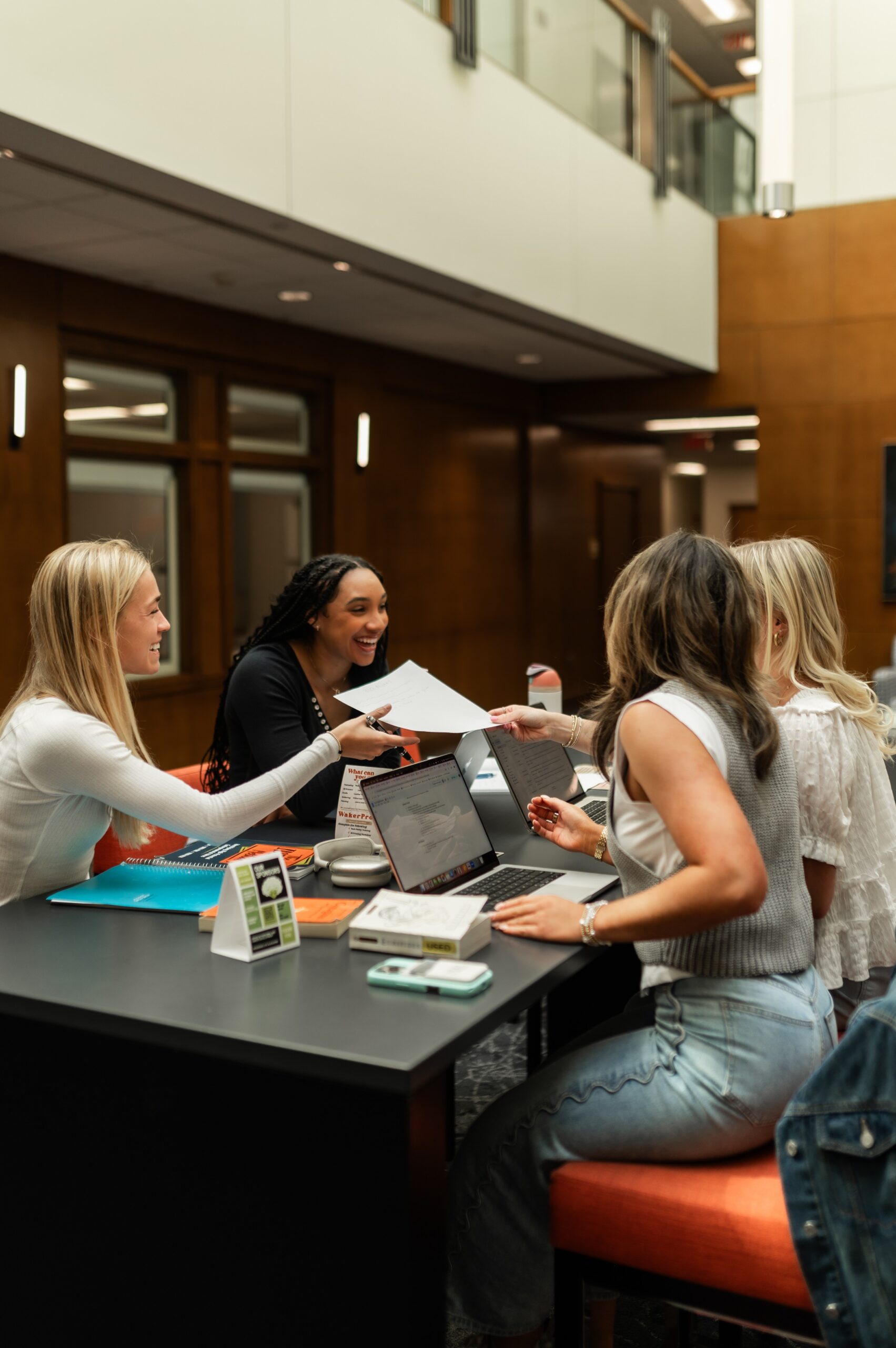 university peers sharing study materials scaled
