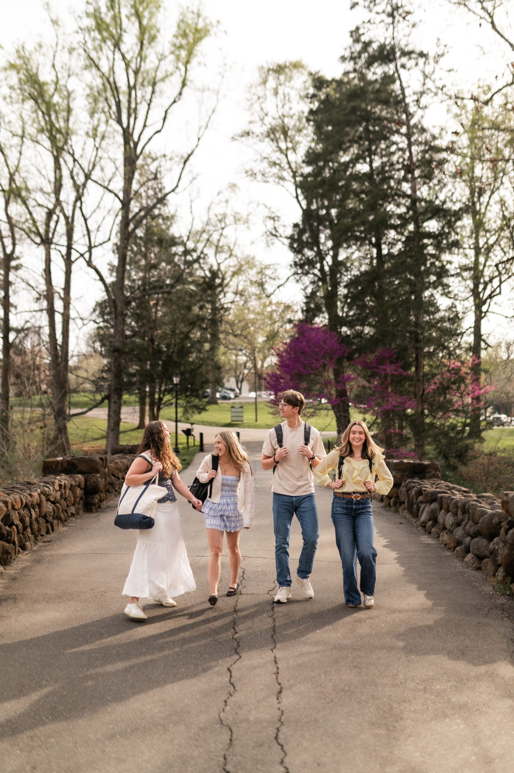 university students walking on paved path scaled